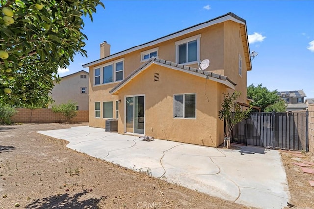 3020 Peaceful Way, Lancaster, CA 93535 - back of house featuring stucco siding, a fenced backyard, a patio, and a chimney
