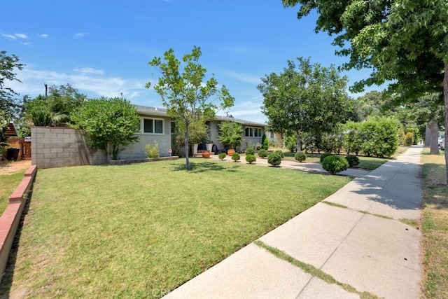 10923 Haskell Ave, Granada Hills, CA 91344 - view of front facade with a front lawn