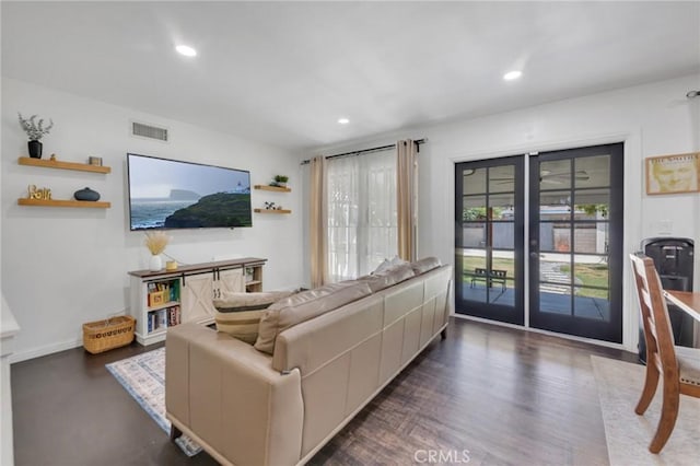 10923 Haskell Ave, Granada Hills, CA 91344 - living area featuring healthy amount of natural light, recessed lighting, french doors, and wood finished floors