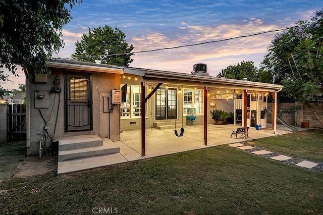 10923 Haskell Ave, Granada Hills, CA 91344 - back of property with a patio area, stucco siding, and a chimney