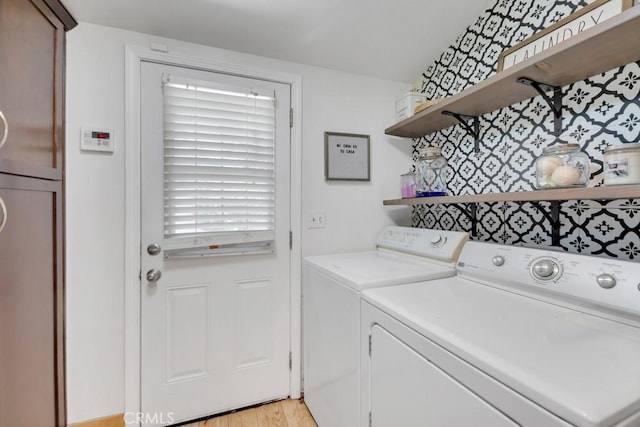 10923 Haskell Ave, Granada Hills, CA 91344 - laundry room with washing machine and clothes dryer, plenty of natural light, and light wood-style floors