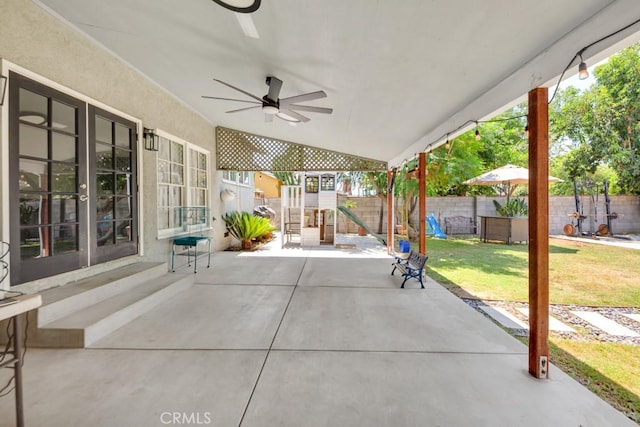10923 Haskell Ave, Granada Hills, CA 91344 - fenced backyard featuring ceiling fan, a patio area, a playground, and french doors