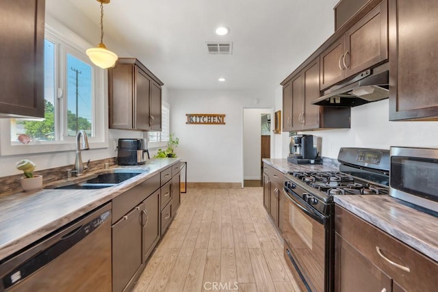 10923 Haskell Ave, Granada Hills, CA 91344 - kitchen with appliances with stainless steel finishes, light wood-type flooring, dark brown cabinetry, under cabinet range hood, and recessed lighting