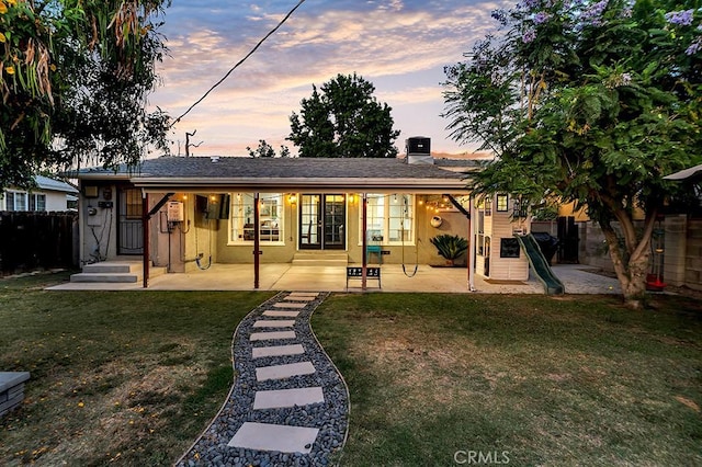 10923 Haskell Ave, Granada Hills, CA 91344 - back of house featuring a chimney and a patio area