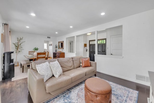10923 Haskell Ave, Granada Hills, CA 91344 - living room with healthy amount of natural light, dark wood-style floors, and recessed lighting
