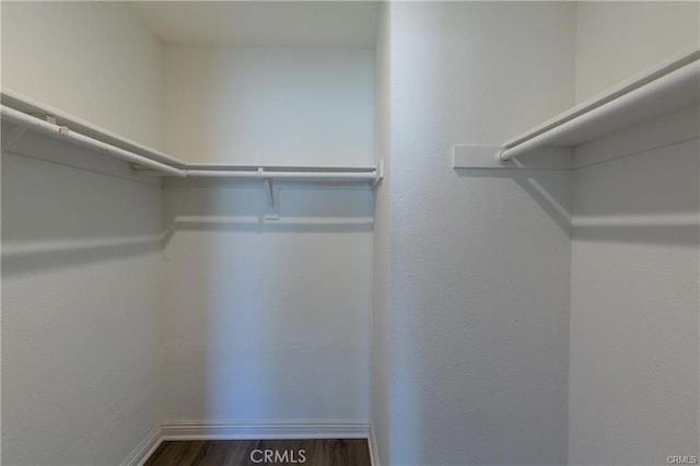 24297 El Pilar, Laguna Niguel, CA 92677 - spacious closet featuring dark wood-style floors