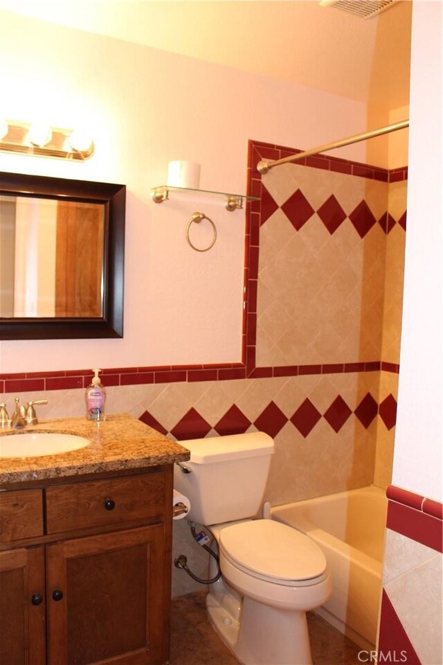 10768 William Ave, Bloomington, CA 92316 - full bath with vanity, shower / washtub combination, and tile walls