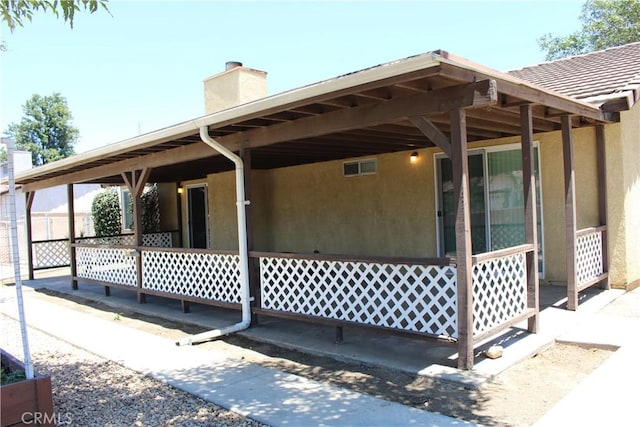 10768 William Ave, Bloomington, CA 92316 - exterior space featuring a chimney and stucco siding