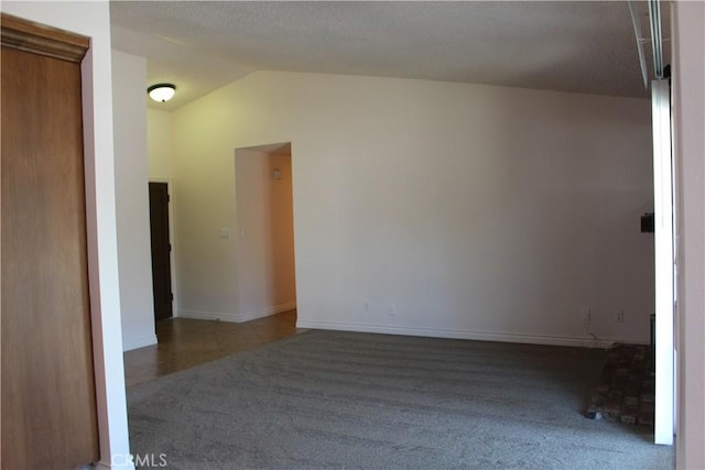10768 William Ave, Bloomington, CA 92316 - carpeted spare room featuring vaulted ceiling and baseboards