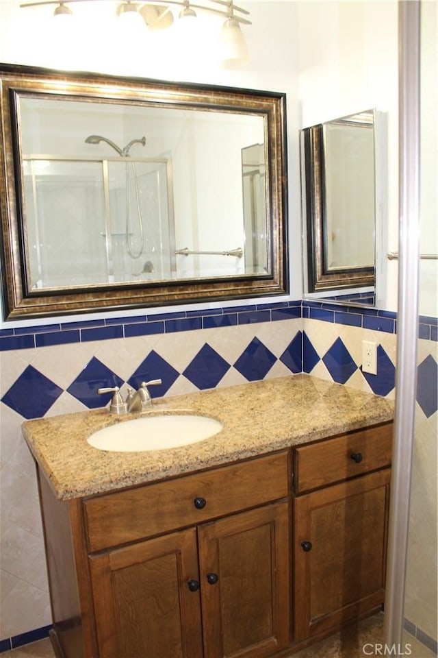 10768 William Ave, Bloomington, CA 92316 - full bath with vanity, tile walls, and a shower with door