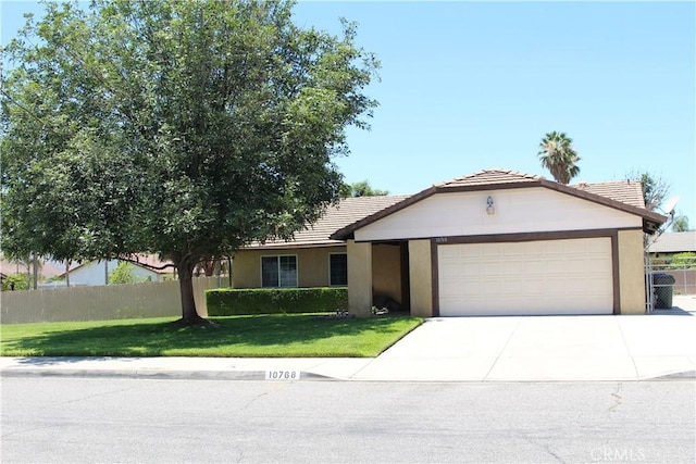 10768 William Ave, Bloomington, CA 92316 - ranch-style house featuring driveway, a garage, a tile roof, and stucco siding