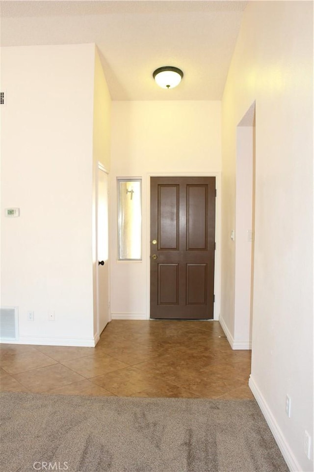 10768 William Ave, Bloomington, CA 92316 - foyer entrance featuring tile patterned floors and baseboards