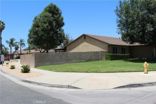10768 William Ave, Bloomington, CA 92316 - view of side of home featuring stucco siding and a tiled roof