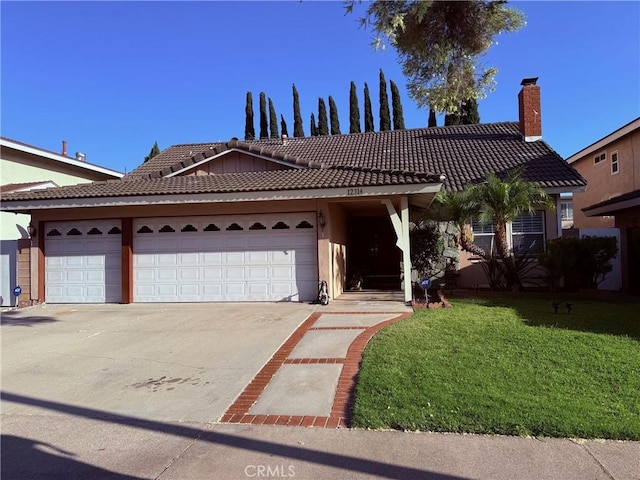 12314 Edgefield St, Cerritos, CA 90703 - ranch-style house featuring a tile roof, an attached garage, a front yard, and driveway