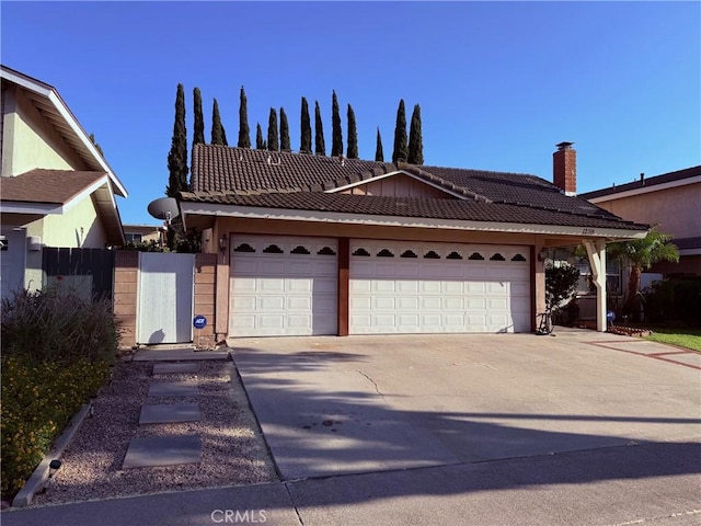 12314 Edgefield St, Cerritos, CA 90703 - ranch-style house featuring a tile roof, driveway, a garage, and stucco siding