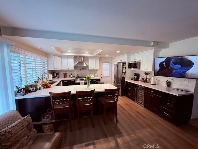 12314 Edgefield St, Cerritos, CA 90703 - dining area featuring a raised ceiling, dark wood finished floors, beverage cooler, and recessed lighting