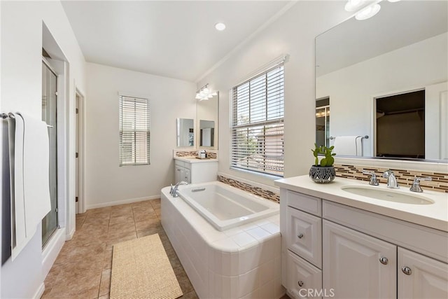 41 Somerton, Irvine, CA 92620 - full bathroom with two vanities, a garden tub, decorative backsplash, a shower stall, and tile patterned floors