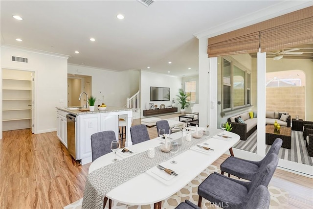41 Somerton, Irvine, CA 92620 - dining room featuring ornamental molding, light wood-type flooring, recessed lighting, and plenty of natural light