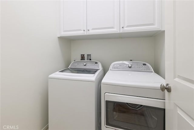 41 Somerton, Irvine, CA 92620 - laundry area with washer and clothes dryer and cabinet space