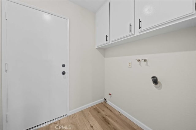 43906 Broadwater Ave, Lancaster, CA 93535 - laundry room with cabinet space, light wood finished floors, gas dryer hookup, and washer hookup