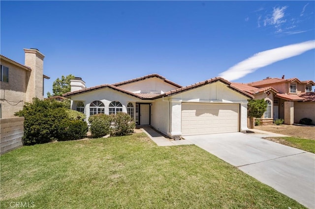 43906 Broadwater Ave, Lancaster, CA 93535 - mediterranean / spanish house with an attached garage, driveway, a front yard, stucco siding, and a tile roof
