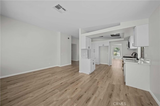 43906 Broadwater Ave, Lancaster, CA 93535 - unfurnished living room with light wood-style flooring and baseboards