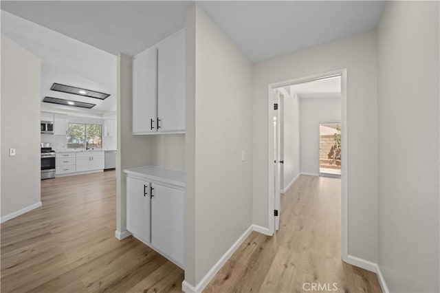 43906 Broadwater Ave, Lancaster, CA 93535 - corridor featuring light wood-type flooring