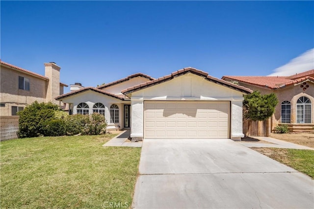 43906 Broadwater Ave, Lancaster, CA 93535 - mediterranean / spanish-style home featuring an attached garage, driveway, stucco siding, and a tiled roof