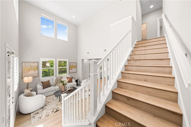 22 Lomada St, Rancho Mission Viejo, CA 92694 - stairs with plenty of natural light, wood finished floors, a high ceiling, and recessed lighting