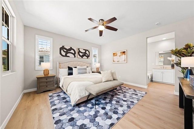 22 Lomada St, Rancho Mission Viejo, CA 92694 - bedroom with light wood finished floors, ensuite bath, and ceiling fan