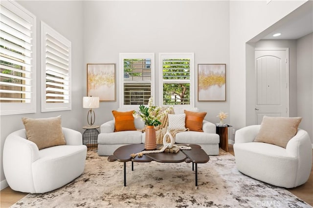 22 Lomada St, Rancho Mission Viejo, CA 92694 - living area featuring a high ceiling, wood finished floors, and recessed lighting