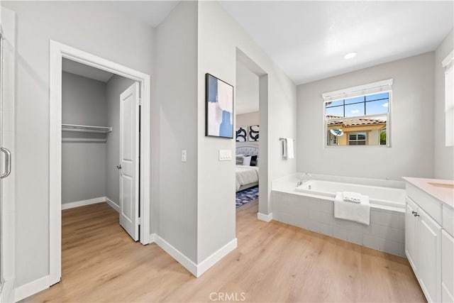 22 Lomada St, Rancho Mission Viejo, CA 92694 - full bathroom featuring wood finished floors, ensuite bathroom, a bath, and vanity