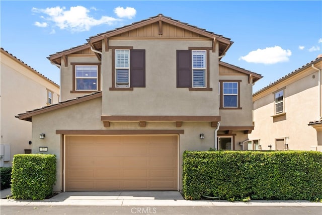 22 Lomada St, Rancho Mission Viejo, CA 92694 - view of front of house with a garage, stucco siding, and board and batten siding