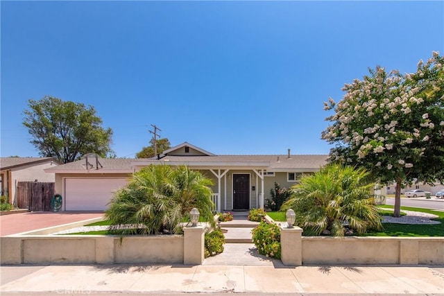 1524 Casarin Ave, Simi Valley, CA 93065 - view of front of house featuring a fenced front yard, a garage, driveway, and stucco siding