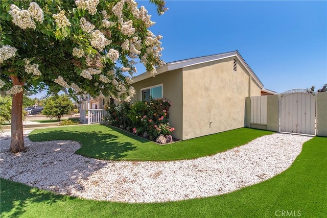 1524 Casarin Ave, Simi Valley, CA 93065 - view of home's exterior with a gate and stucco siding
