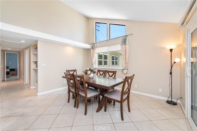 1524 Casarin Ave, Simi Valley, CA 93065 - dining area with light tile patterned floors, built in shelves, and a towering ceiling