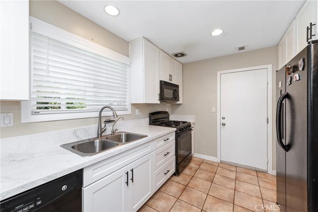 1524 Casarin Ave, Simi Valley, CA 93065 - kitchen featuring black appliances, white cabinets, recessed lighting, and light tile patterned floors
