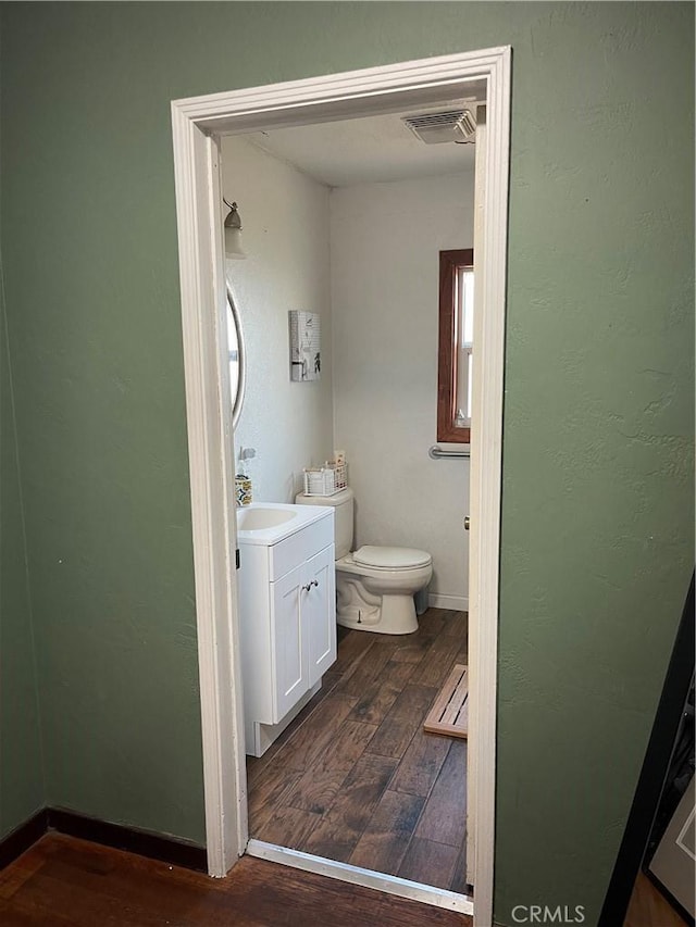 537 Drakeley Ave, Atwater, CA 95301 - bathroom featuring hardwood / wood-style flooring and vanity