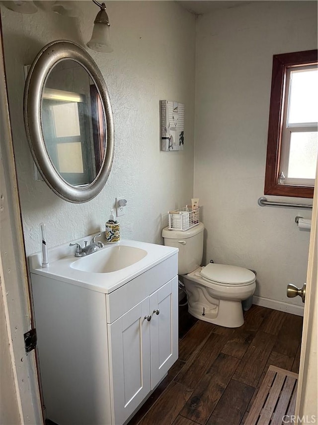 537 Drakeley Ave, Atwater, CA 95301 - bathroom featuring vanity, wood finished floors, and a textured wall