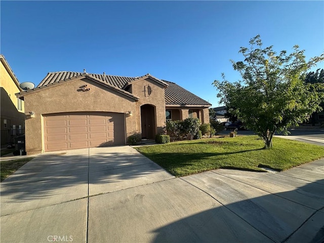 5834 Gem Ct, Lancaster, CA 93536 - mediterranean / spanish-style house with stucco siding, an attached garage, driveway, a tile roof, and a front yard
