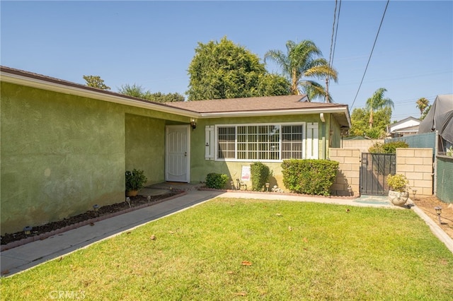 3133 Juanita St, Riverside, CA 92504 - view of front of home with stucco siding and a gate