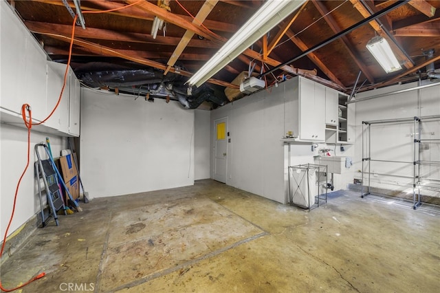 3133 Juanita St, Riverside, CA 92504 - garage with a garage door opener and a sink