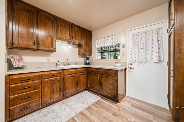 3133 Juanita St, Riverside, CA 92504 - kitchen with light wood-style floors and light countertops