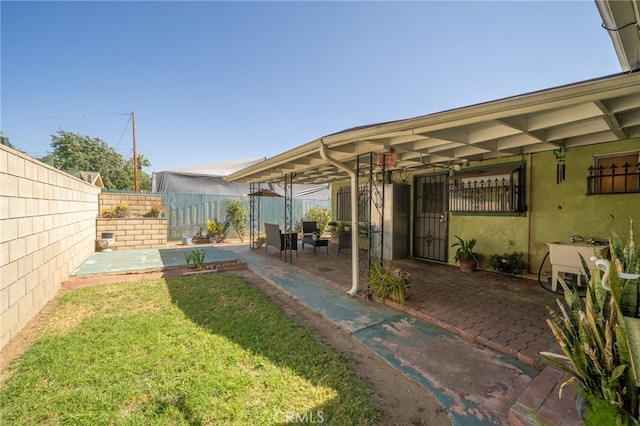 3133 Juanita St, Riverside, CA 92504 - fenced backyard with a patio area