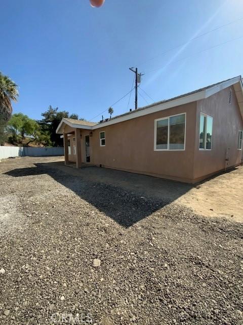 840 W 27th St, San Bernardino, CA 92405 - rear view of house featuring stucco siding
