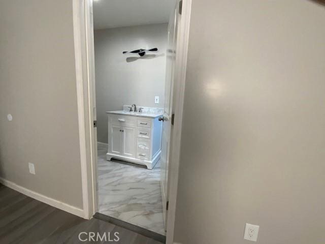 840 W 27th St, San Bernardino, CA 92405 - hall featuring baseboards and a sink