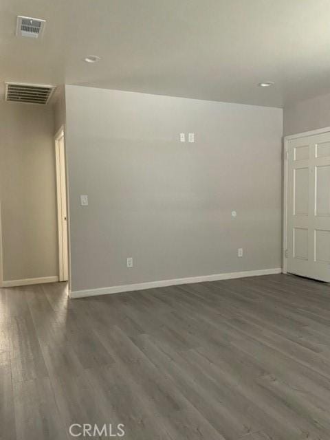 840 W 27th St, San Bernardino, CA 92405 - empty room featuring dark wood-type flooring and recessed lighting