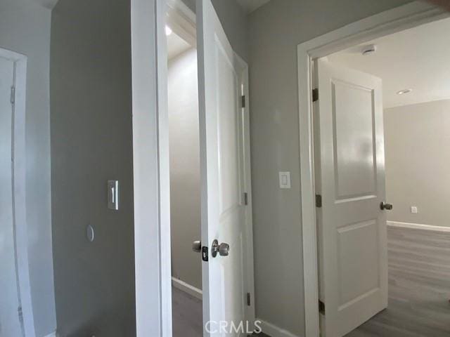 840 W 27th St, San Bernardino, CA 92405 - hall with baseboards and wood finished floors