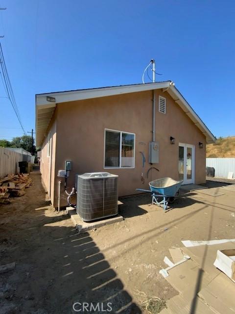 840 W 27th St, San Bernardino, CA 92405 - back of house featuring stucco siding, a patio, and french doors
