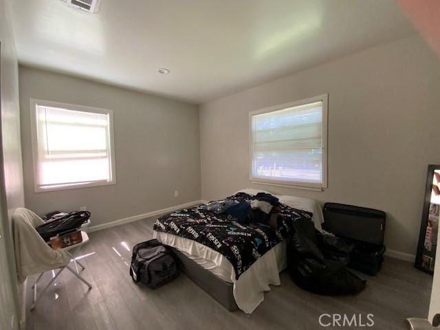 840 W 27th St, San Bernardino, CA 92405 - bedroom with wood finished floors and baseboards